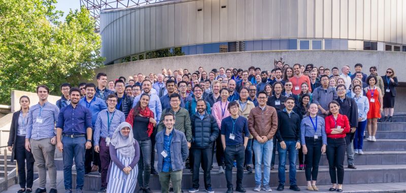 An image of the members of Exciton Science standing together in a large group outside the Arts Centre Melbourne in December 2019.