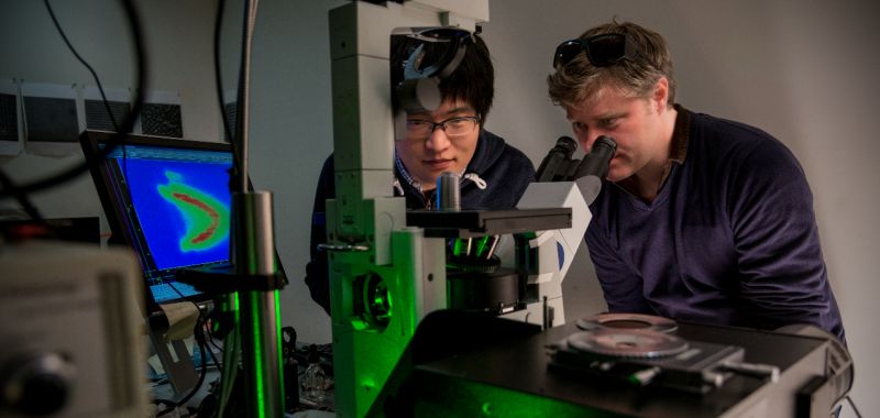 Dr James Hutchison (right) is pictured using equipment with a colleague in the School of Chemistry at the University of Melbourne.
