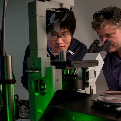 Dr James Hutchison (right) is pictured using equipment with a colleague in the School of Chemistry at the University of Melbourne.