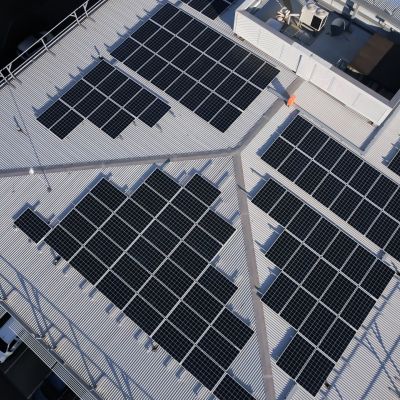 An aerial image of silicon solar panels mounted on a rooftop at Monash University's Clayton campus